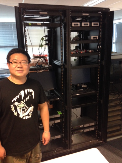 Lei Qian in front of the racks during an early stage of construction in mid-February 2016. A lot of parts have moved around since, and space in some of the racks is now at a premium!